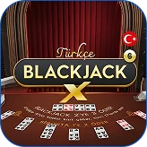 Winnita Casino – Croupier donna con carte da poker su tavolo nero